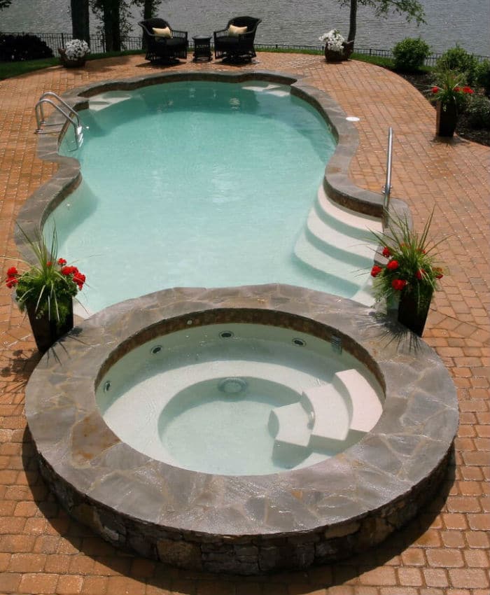 Trilogy Sentari Classic Freeform Shaped Pool With Neptune Spa. Swim World Pools.